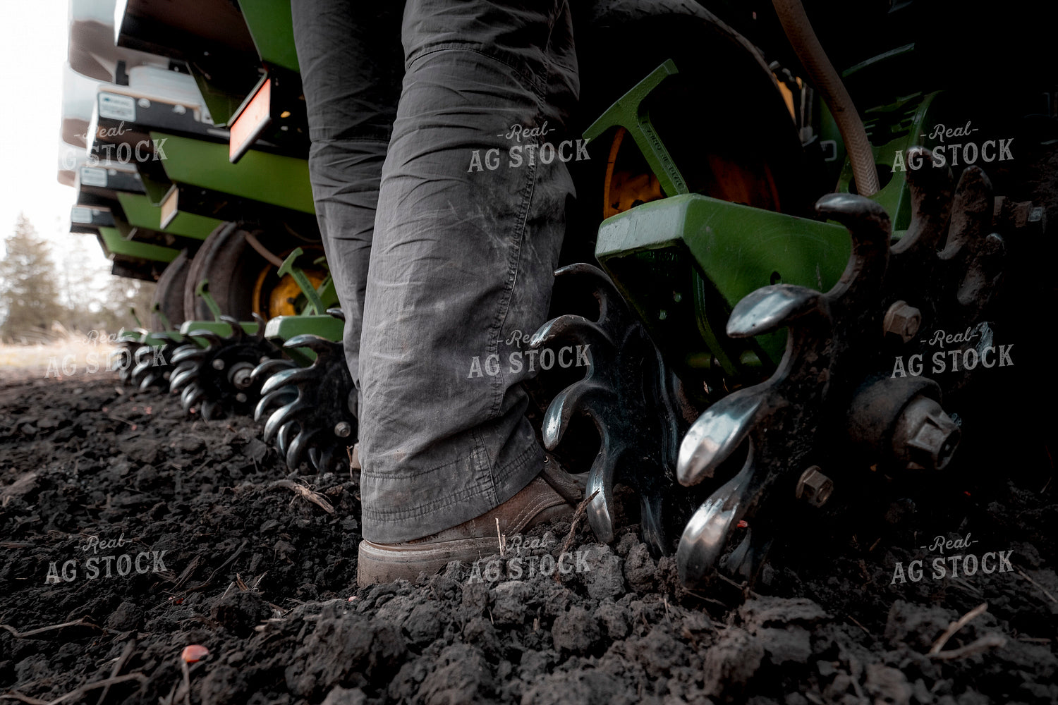 Farmer Boots Next to Planter 250070