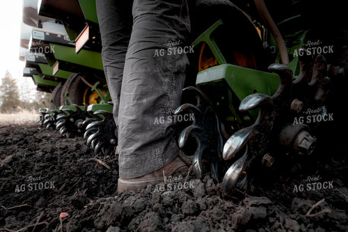 Farmer Boots Next to Planter 250070