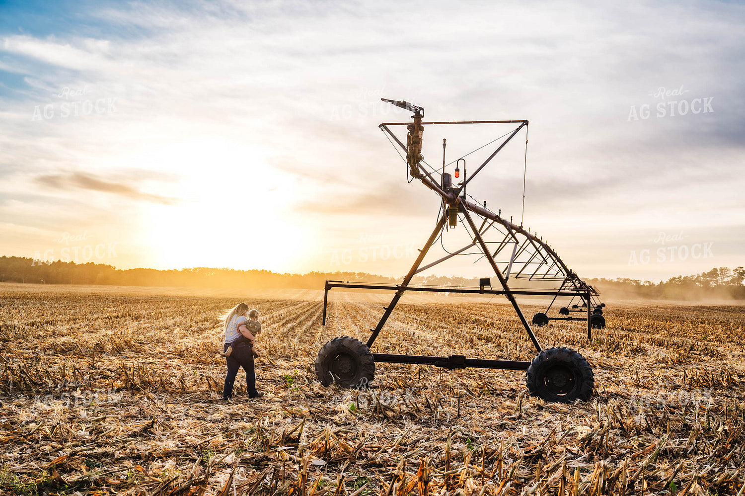 Female Farmer and Farm Kid Checking Pivot Irrigation 115384