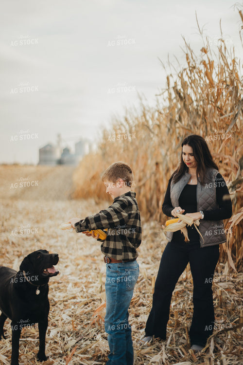 Farm Wife and Kid Checking Corn 9466