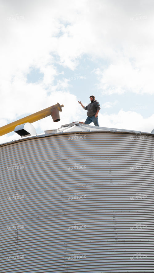 Farmer Lining Up Auger 26273