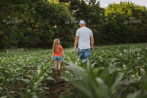 Farmer and Daugther Checking Corn 8745