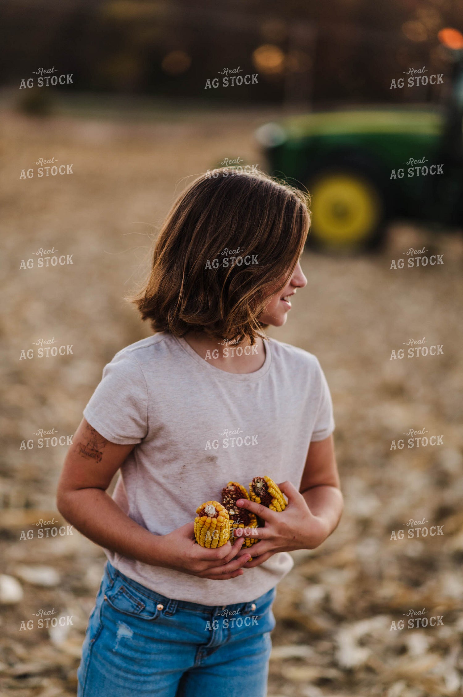 Farm Kid Holding Ears of Corn 115050