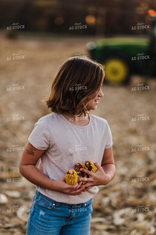 Farm Kid Holding Ears of Corn 115050