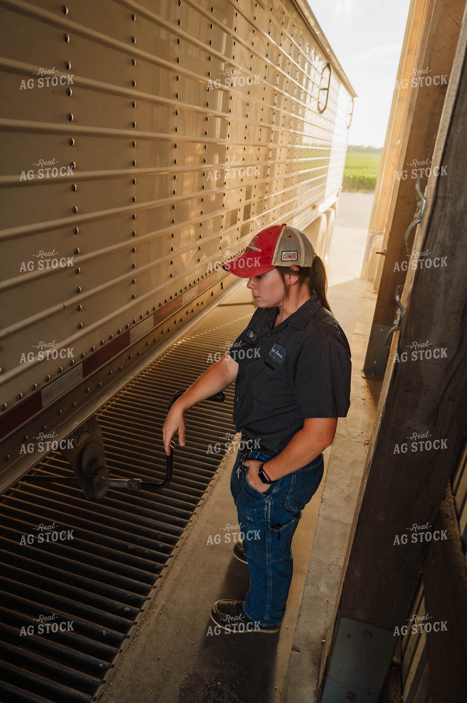 Female Farmer Dumping Semi 115257