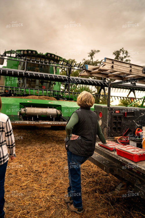 Farmers Fixing Combine Head 115411