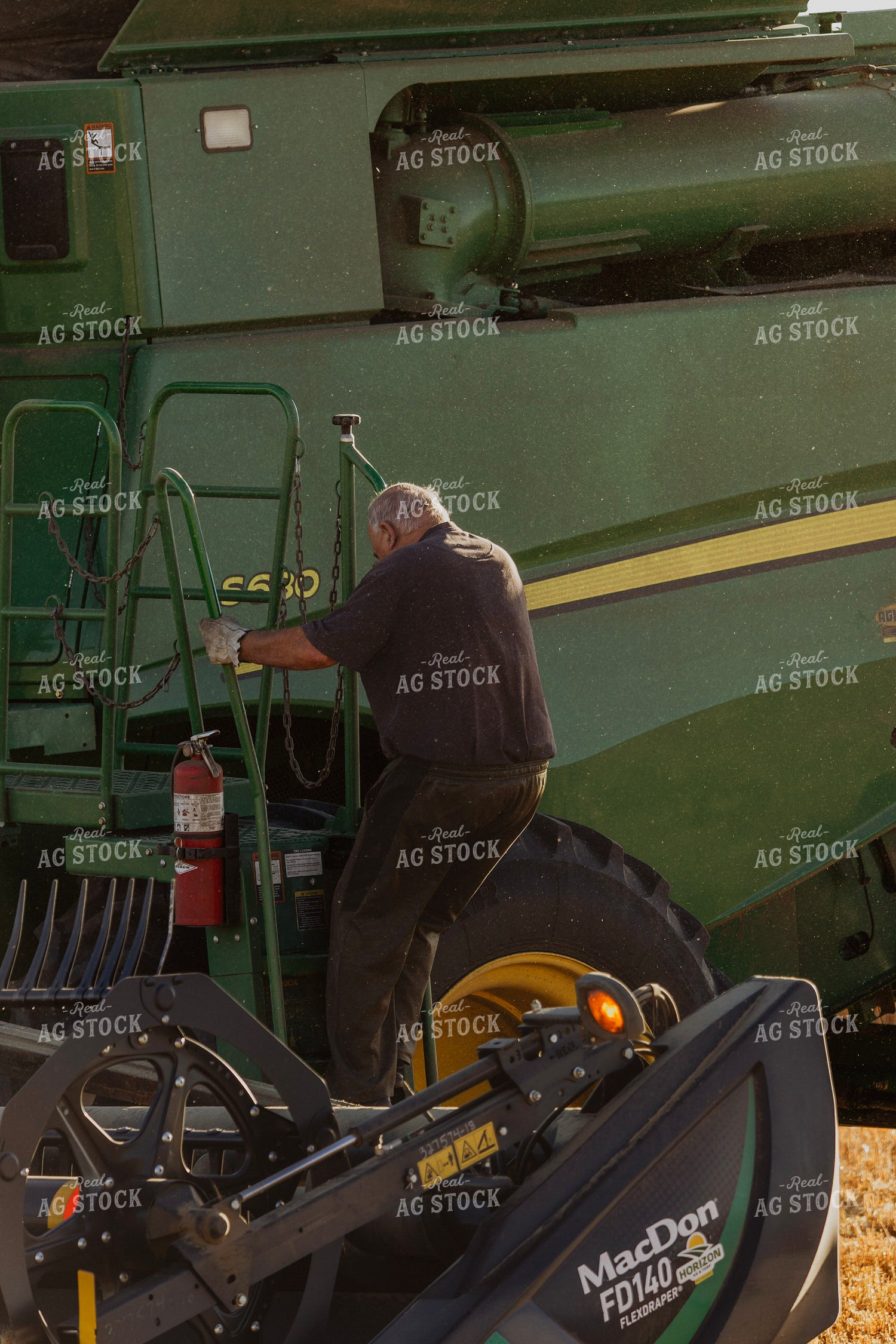 Farmer Climbing Out of Combine 187294