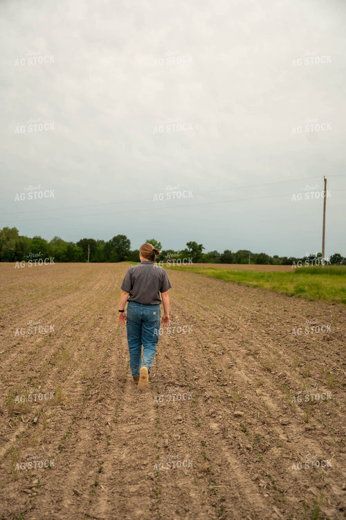Female Farmer Walking in Field 115720