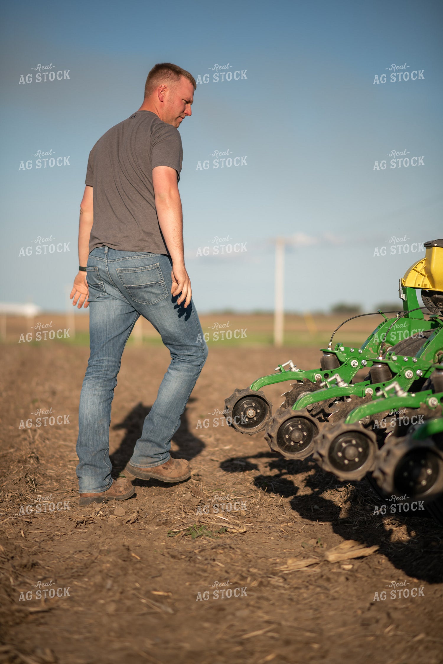 Farmer Walking Away from Planter 76378