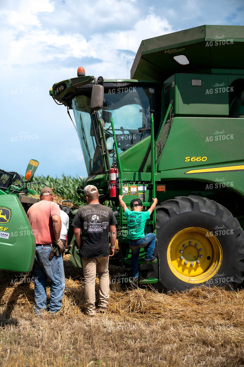 Farm Kid Climbing into Combine 115824