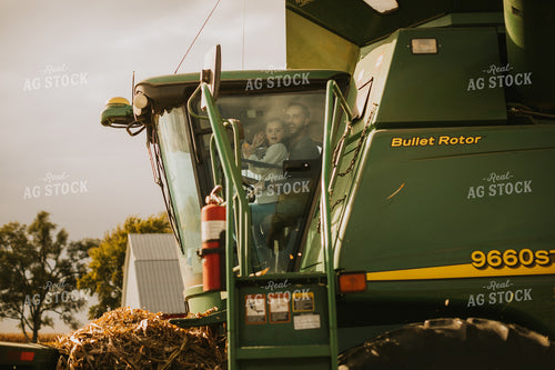 Farmer and Farm Kid in Combine 6589
