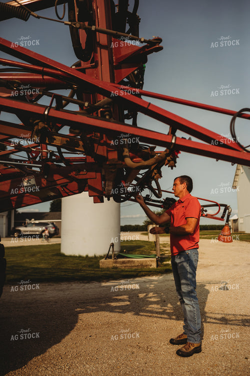 Farmer Checking Sprayer Nozzles 4450