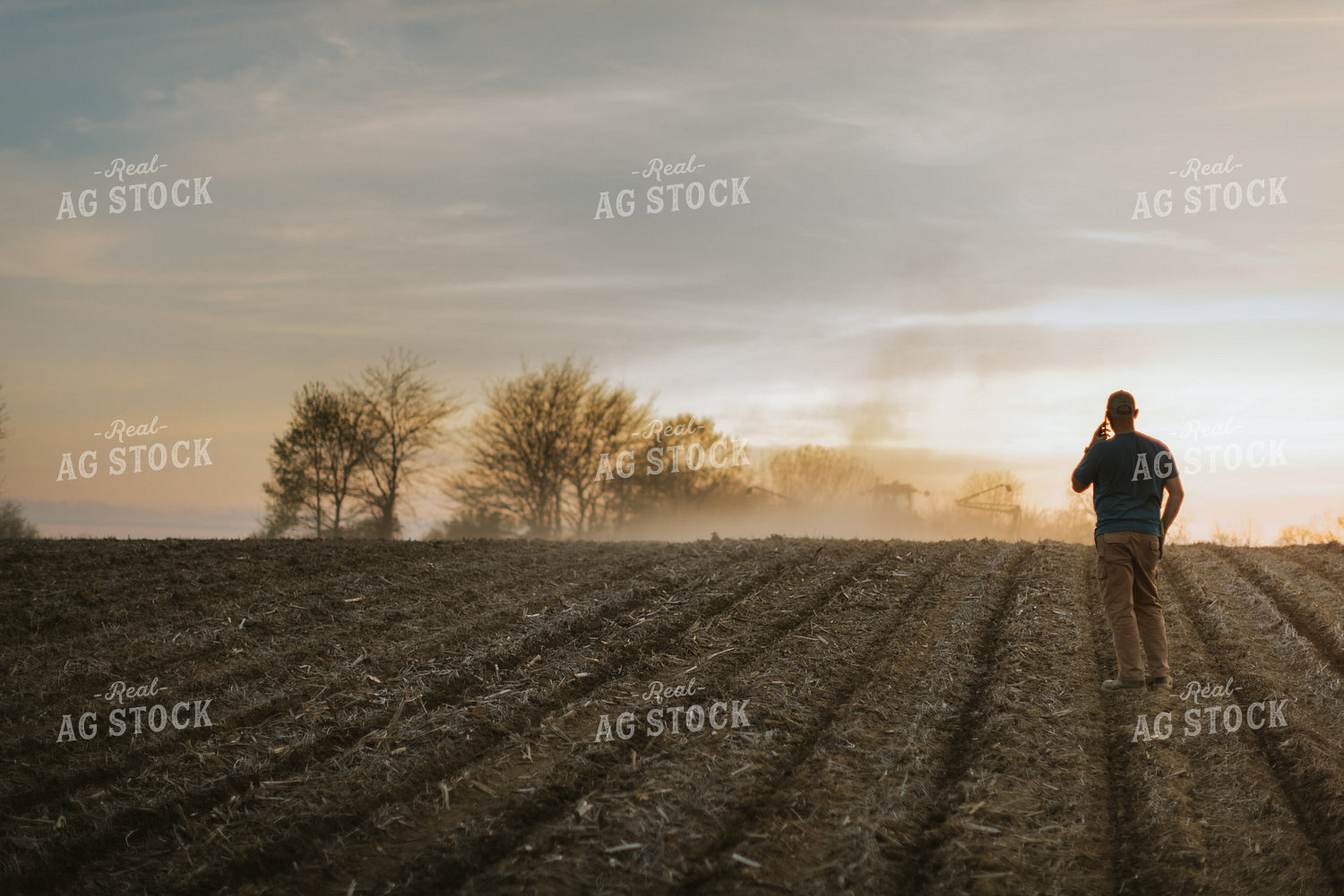 Farmer Talking on Phone in Field 7462