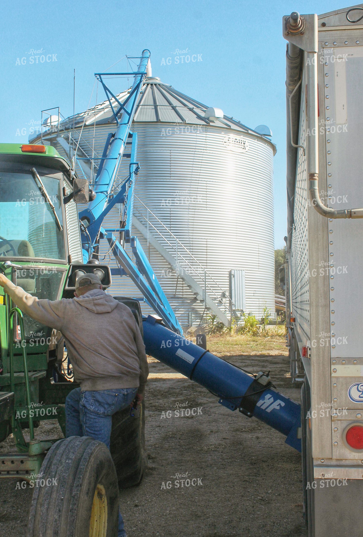 Farmer Unloading Semi into Grain Bin 141426