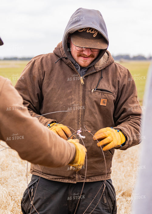 Ranchers Fixing Fence 231066