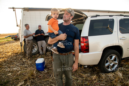 Family Enjoying Harvest Meal in the Field 25812