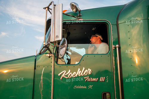 Farmer Talking on the Phone in the Semi Cab 25478
