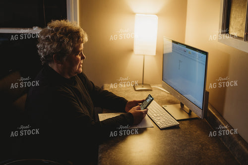 Farmer Using Smart Phone and Computer for Farm Accounting 3706