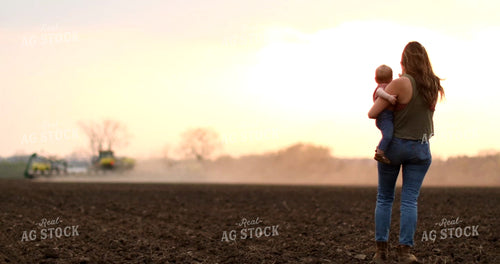 Farm Mom with Farm Kid in Field Planting 6026