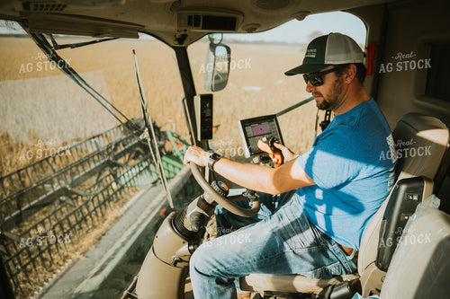 Farmer Operating Combine 7105