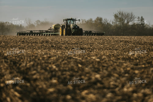 Tractor Planting Field While Child Sits on Farmer's Lap 7659