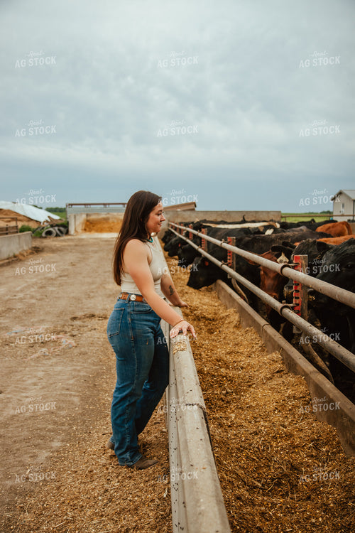 Female Farmer Checking Cattle 67769
