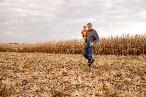 Grandson and Grandfather Farmer in Field 25830