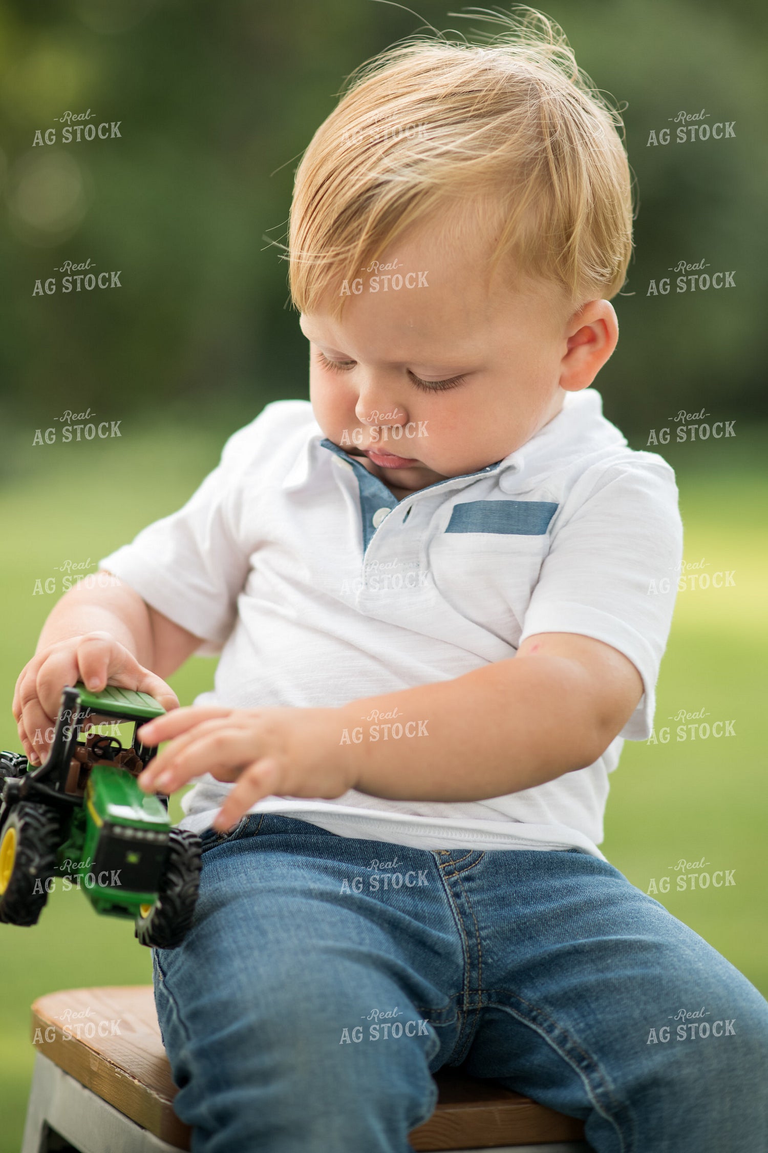 Farm Kid with Toy Tractor 76396