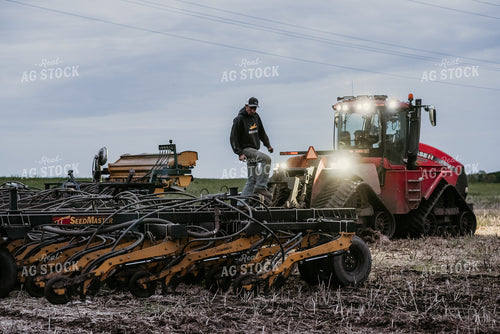 Farmer Looking at Air Seeder 64264