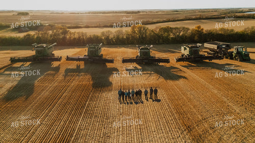 Farmers Standing in Field by Combines 187300