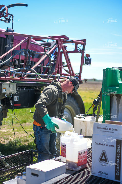 Farmer Mixing Chemicals for Self Propelled Sprayer 191058