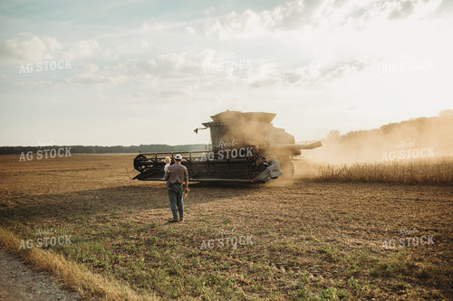 Farmer and Farm Kid Getting into Combine 4828