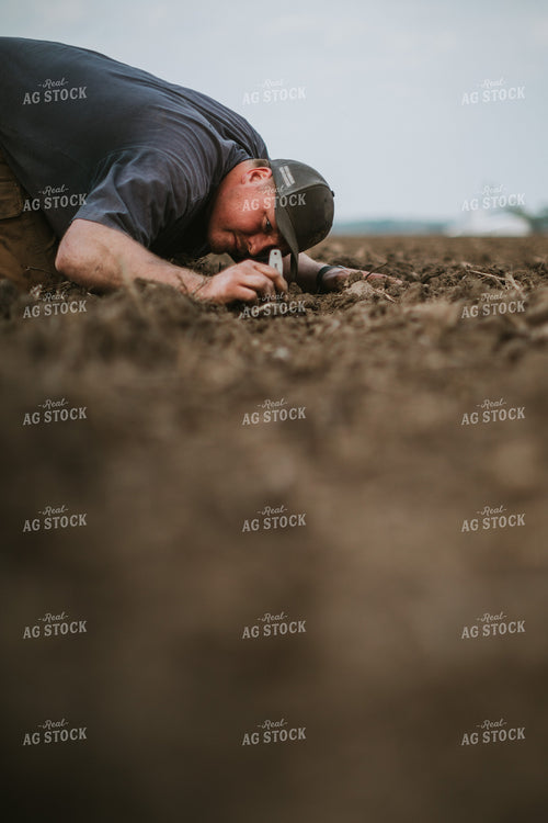 Farmer Checking Seed Depth 5662
