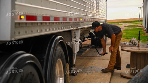 Farmer Unloading Corn from Hopper Bottom Semi to Grain Pit 25664