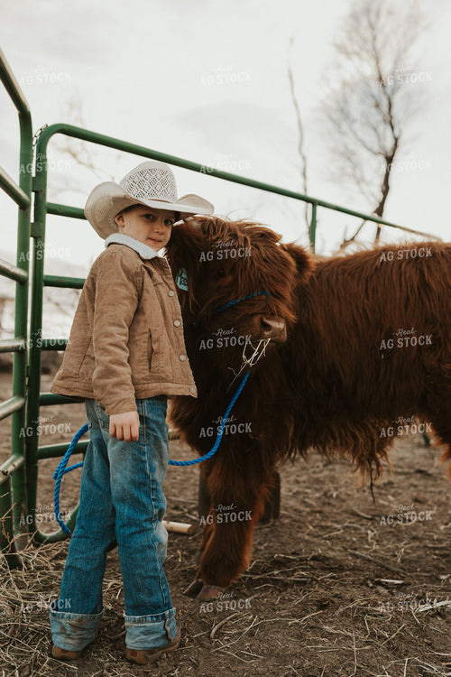 Farm Kid with Highland Calf 61226