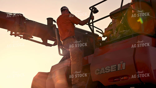 Multigenerational Farm Familiy Repairing Combine in a Bean Field 25516