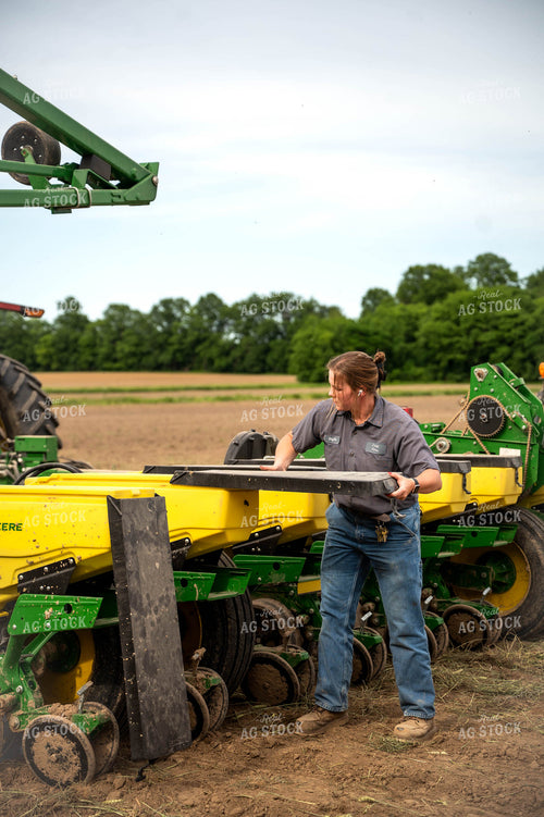 Female Farmer Filling Planter 115649
