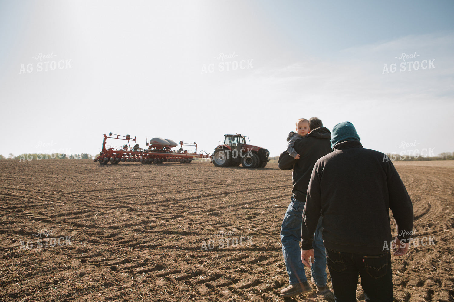 Farm Family in Field During Planting 26051