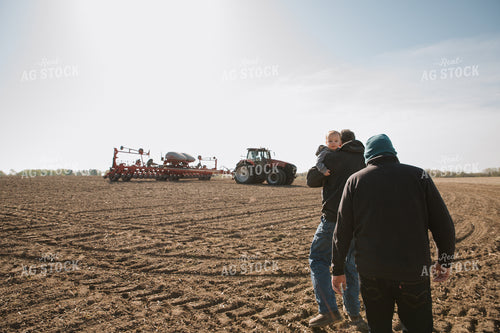 Farm Family in Field During Planting 26051