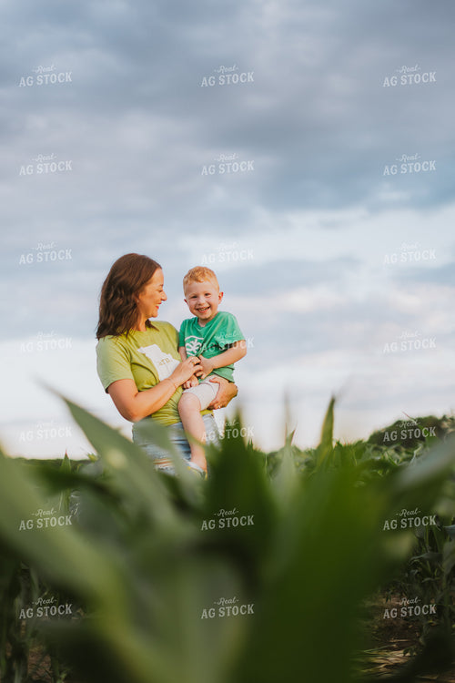 Female Farmer and Son Checking Corn 8810