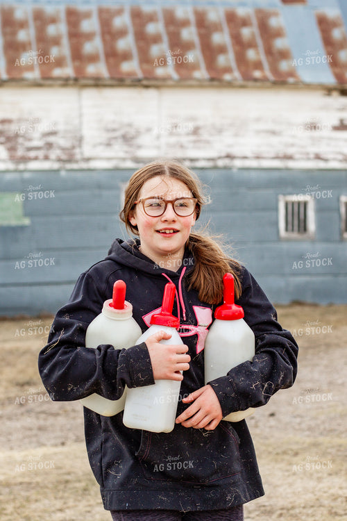 Farm Kid Carrying Calf Bottles 155382