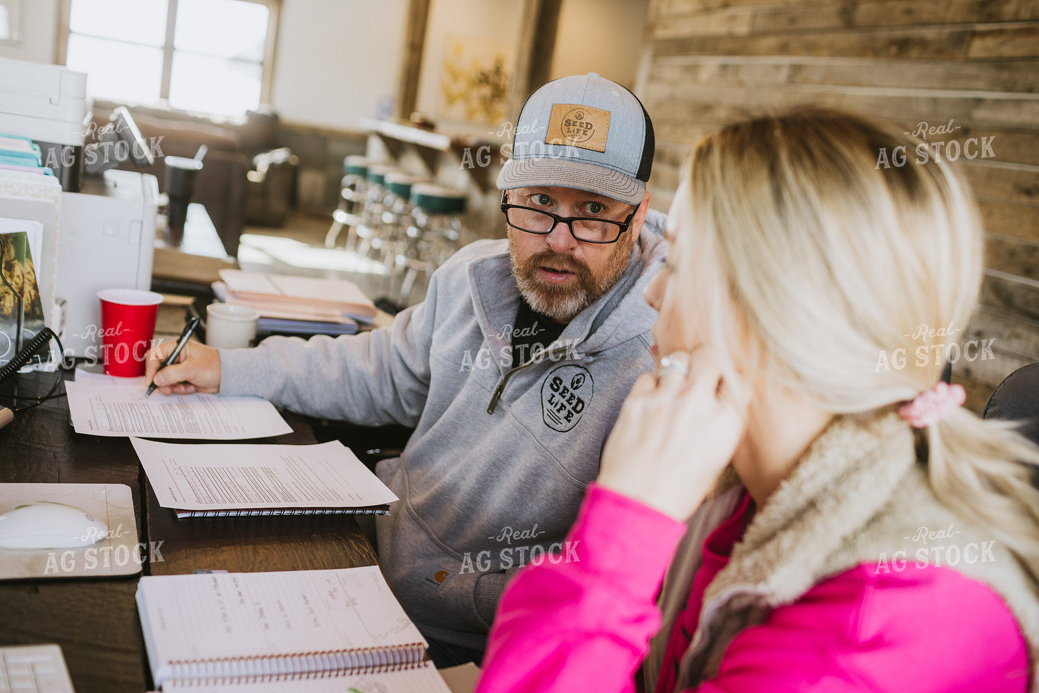 Man and Woman Going Over Paperwork 5343