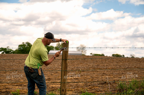 Farmer Building Fence 115924