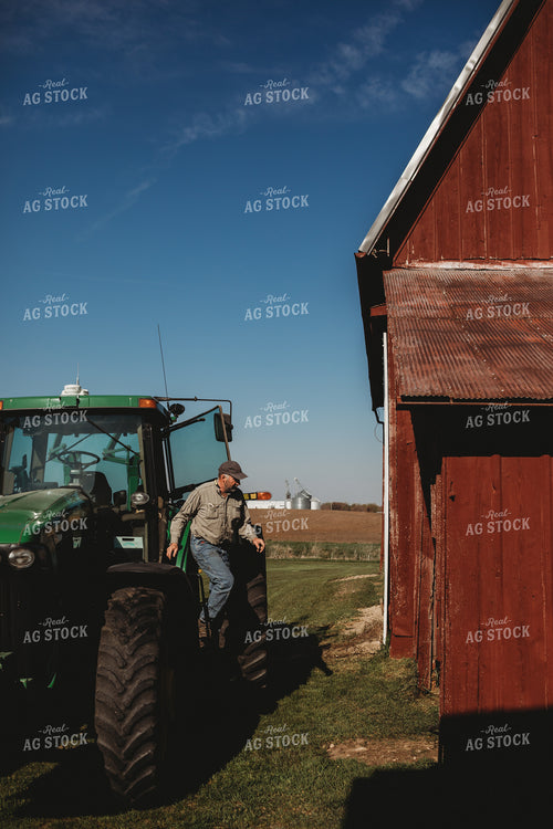 Farmer Climbing out of Tractor Red Barn 4085