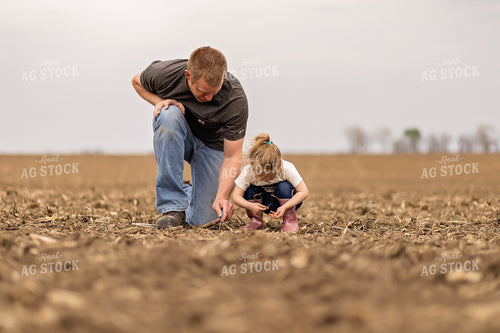 Farmer and Daughter Checking Soybeans 93305