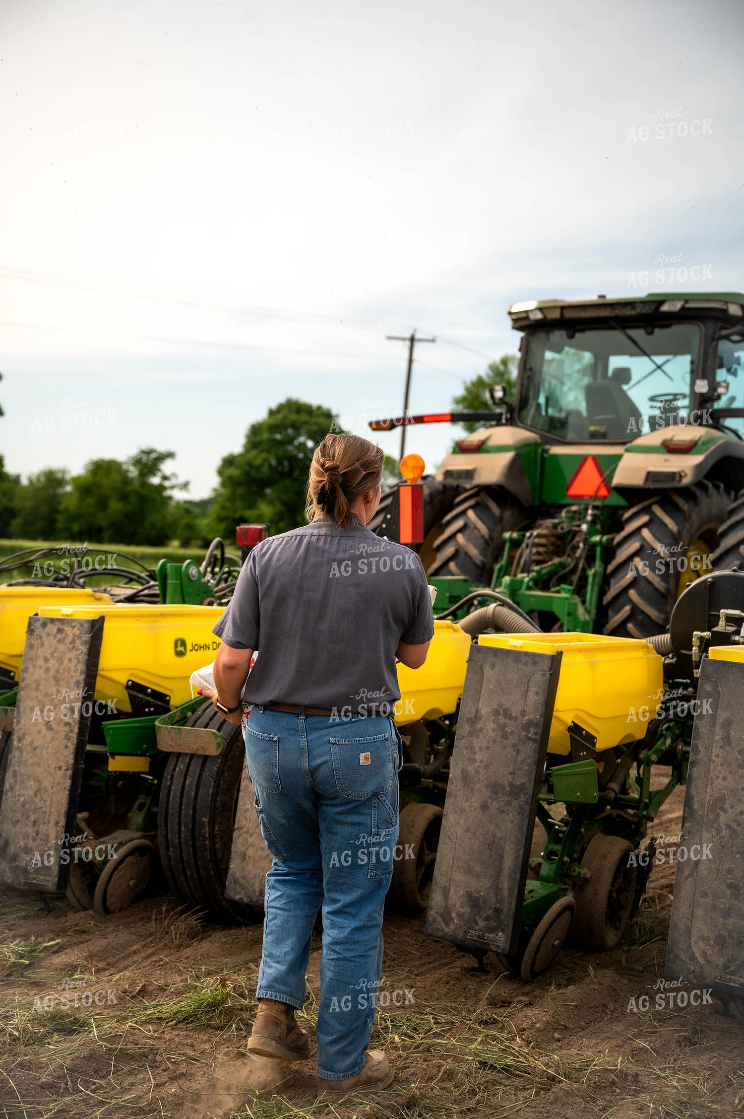 Female Farmer Filling Planter 115627