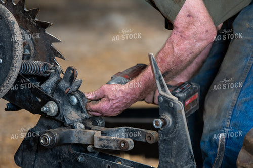 Farmer Working in Shed 50270