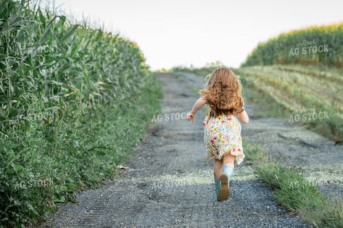 Farm Kid Running on Gravel Road 270082