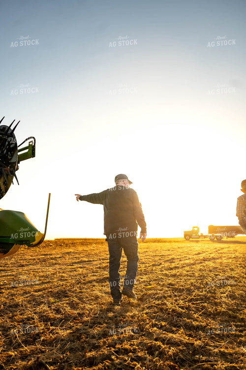 Farmers Walking by Combine 115594