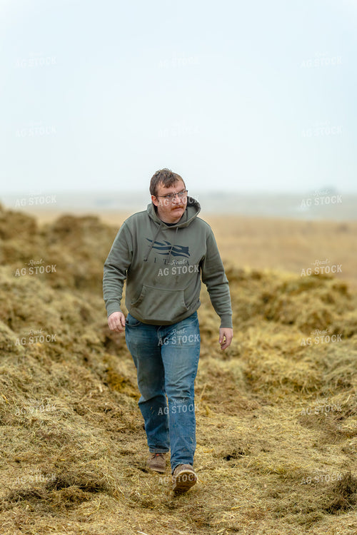 Rancher Walking in Pasture 155345